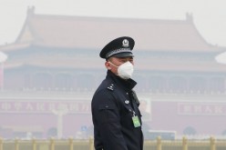 A policeman wearing a a mask to protect himself from air pollution. China's air quality is considered as one of the most severe in the world.