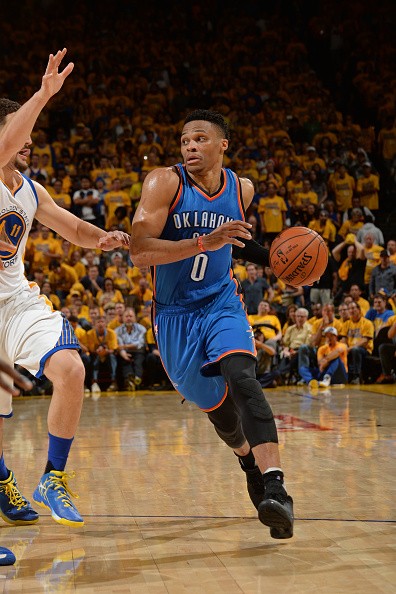 Russell Westbrook of the Oklahoma City Thunder drives against the Golden State Warriors defense during Game Seven of the Western Conference Finals