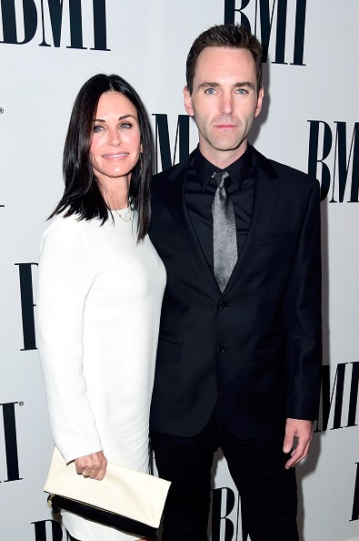 Actress Courteney Cox (L) and musician Johnny McDaid of Snow Patrol attend The 64th Annual BMI Pop Awards, honoring Taylor Swift and songwriting duo Mann & Weil, at the Beverly Wilshire Four Seasons Hotel on May 10, 2016 in Beverly Hills, California. 