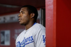 Yasiel Puig looks on from the dugout against the Arizona Diamondbacks at Chase Field on July 17, 2016.