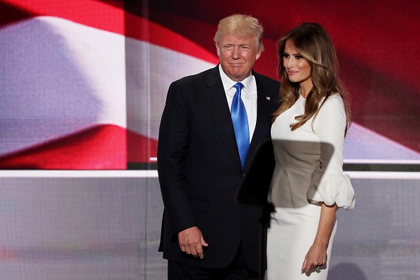 Presumptive Republican presidential nominee Donald Trump stands with his wife Melania after she delivered a speech on the first day of the Republican National Convention on July 18, 2016 at the Quicken Loans Arena in Cleveland, Ohio.