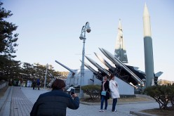 People are taking pictures of a display of model missiles at the War Memorial of Korea on Feb. 7, 2016, in Seoul, South Korea.