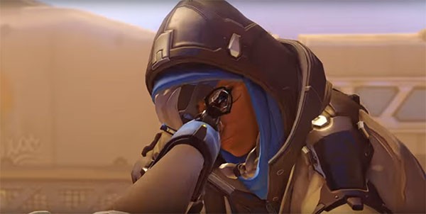 New "Overwatch" healing sniper Ana fires a shot at an enemy in a battle.