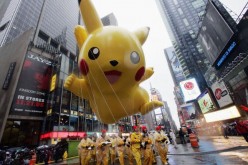 The Pikachu balloon makes its way down a rainy Broadway during the 80th Macy's Thanksgiving Day parade, November 23, 2006 in New York City. 