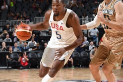 USA's Kevin Durant drives against Andres Nocioni in an exhibition game in Las Vegas.