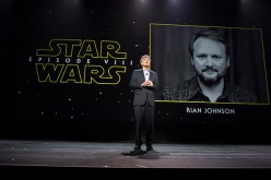 Star Wars Episode VIII director Rian Johnson is shown on the screen during a Disney fan event.
