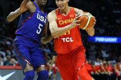 Kevin Durant of the United States defends Yi Jianlian of China during the USA-China exhibition gamein Los Angeles