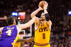 Cleveland Cavaliers power forward Kevin Love shoots over Los Angeles Lakers' Ryan Kelly.