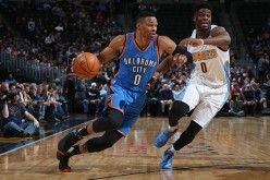 Russell Westbrook drives to the basket against Emmanuel Mudiay at the Pepsi Center last Jan. 19, 2016.