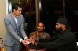 Magician Shimshi performs for NBA players Carmelo Anthony and DeMarcus Cousins during the Team USA welcome dinner at Lakeside at Wynn Las Vegas.