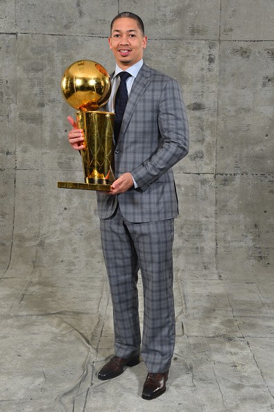 Cavaliers head coach Tyronn Lue poses with the NBA Championship trophy after winning the 2016 NBA title against the Golden State Warriors.