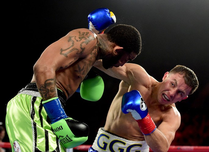 Gennady Golovkin of Kazakhstan punches Dominic Wade on way to a second round TKO during his unified middleweight title fight at The Forum on April 23, 2016 in Inglewood, California.