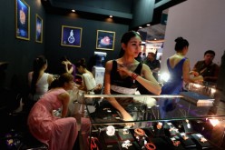 Chinese models show the jewelry at the Luxury China 2013 exhibition on June 22, 2013, in Beijing, China. 