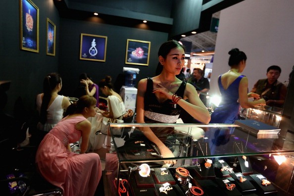 Chinese models show the jewelry at the Luxury China 2013 exhibition on June 22, 2013, in Beijing, China. 