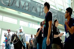 Karl Zingheim (L) of San Diego prepares to showcase his 'White Walker' costume, complete with undead horse, from the show 'Game of Thrones' as he enters the San Diego Convention Center for the 45th annual San Diego Comic-Con on July 24, 2014 in San Diego,