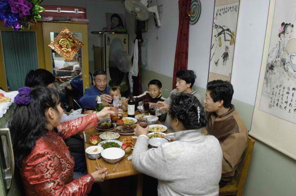 A Chinese family sharing a meal together.