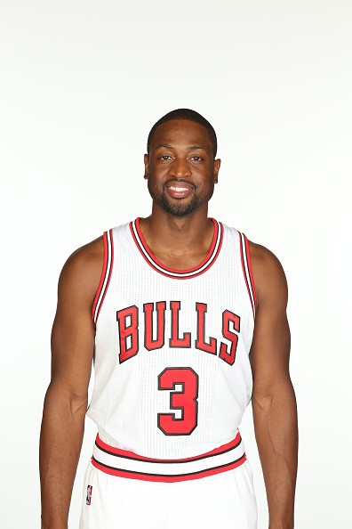 Dwyane Wade poses with his new Chicago Bulls jersey.
