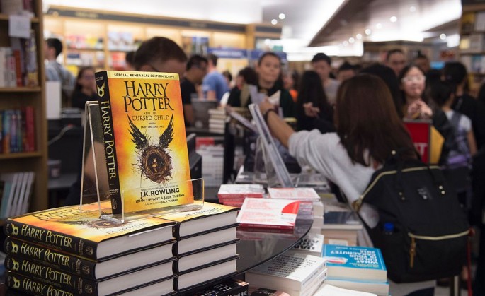 Stacks of new book 'Harry Potter and the Cursed Child' are displayed at a book store during its launch in Singapore on July 31, 2016. Rowling's books have sold more than 450 million copies of harry Potter since 1997 and been adapted into eight films. (Pho