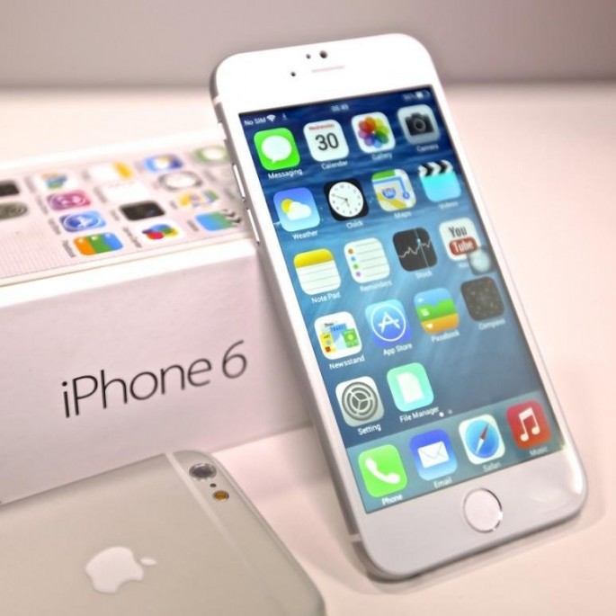 The iPhone 6 is freshly opened and leaning toward its box, which is the latest generation from Apple before iPhone 7's release this September.