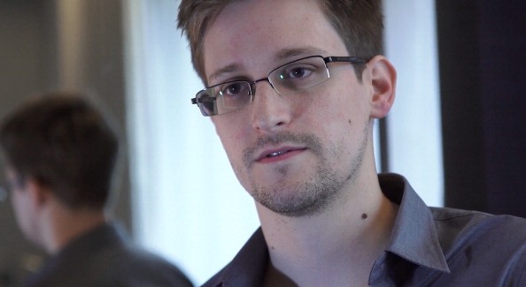 In this handout photo provided by The Guardian, Edward Snowden speaks during an interview in Hong Kong.