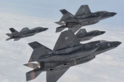 Four U.S. Air Force F-35 stealth fighters in formation.