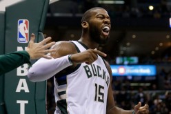 Greg Monroe gets pumped up after making a basket and drawing a foul against the Golden State Warriors.