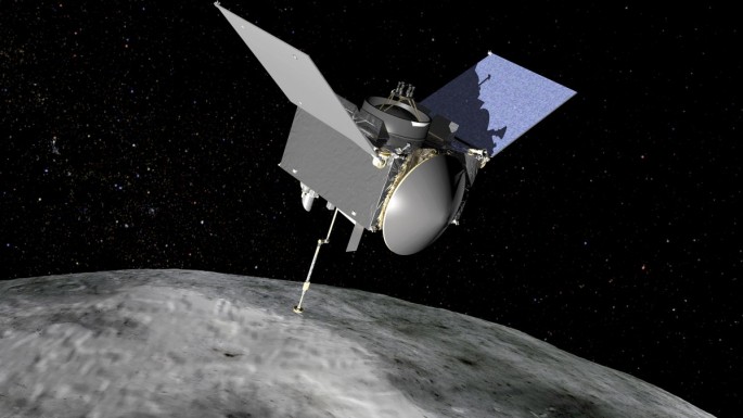 An artist's rendition of the OSIRIS-REx spacecraft hovering over Bennu the asteroid.