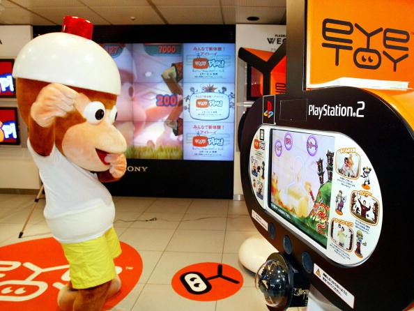 A game character Pipotchi of of the 'Ape Escape 2' demonstrates Sony Computer Entertainment's' motion capture camera 'eyeTOY' for the company's PlayStation 2 video game machine at the Sony's showroom in Tokyo.