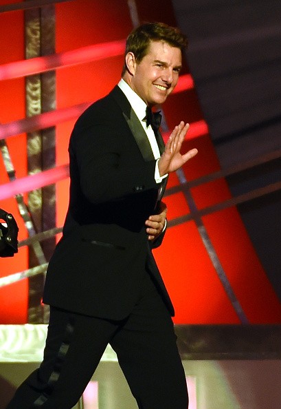 ctor Tom Cruise walks on stage to introduce NASCAR Sprint Cup Series driver Jeff Gordon (not pictured) during the 2015 NASCAR Sprint Cup Series Awards show at Wynn Las Vegas on December 4, 2015 in Las Vegas, Nevada