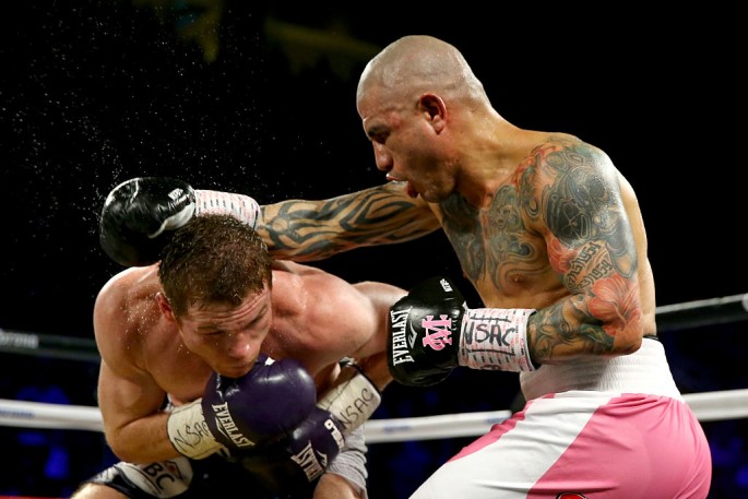 Miguel Cotto throws a right at Canelo Alvarez during their middleweight fight at the Mandalay Bay Events Center on November 21, 2015 in Las Vegas, Nevada.