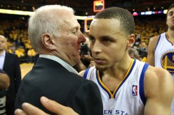 Spurs head coach Gregg Popovich embraces Stephen Curry after Game Six of the 2013 Western Conference Semifinals.