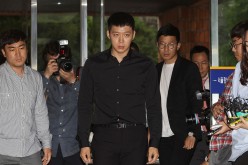 K-pop star Park Yoochun appears at police for questioning over rape allegations.