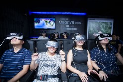 Visitors try out the virtual reality (VR) headsets at the Taobao Maker Festival.