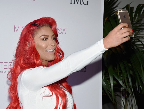 Eva Marie sends a Snapchat during the 2016 Miss Teen USA Competition at The Venetian Las Vegas on July 30, 2016.