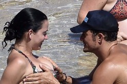 Orlando Bloom and Katy Perry's romantic moments at Sardinia also include Bloom grabbing Perry's breast and the two kissing. 
