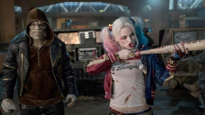 Harley Quinn, who is played by Margot Robbie, is seen in the foreground at a scene in "Suicide Squad", with Killer Croc behind her.