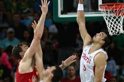 Croatian forward Dario Saric (R) blocks Spanish center Pau Gasol's last-second shot during their team's Olympic game.