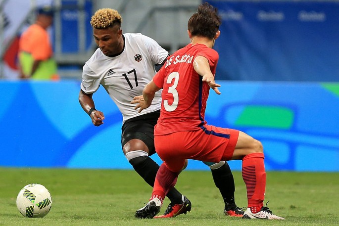 Germany winger Serge Gnabry (#17) against a South Korean defender.