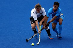 Mats Grambusch #8 of Germany battles Kothajit Khadangbam #5 of India for a loose ball during a Men's Pool B match on Day 3 of the Rio 2016 Olympic Games at the Olympic Hockey Centre on August 8, 2016 in Rio de Janeiro, Brazil. 