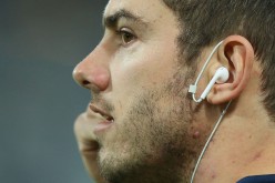 Daniel Menzel of the Cats adjusts his headphones during the round 16 AFL match between the Geelong Cats and the Sydney Swans at Simonds Stadium on July 8, 2016 in Geelong, Australia.