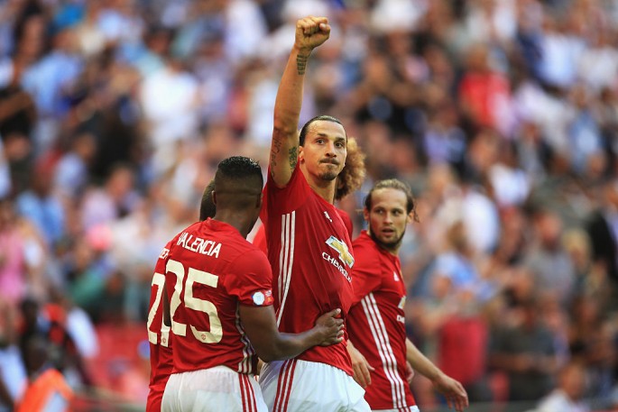Manchester United striker Zlatan Ibrahimović raises his hand in triumph after the team's Community Shield win over Leicester City.