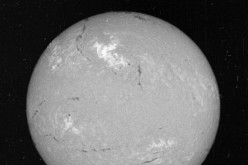 A view of the sun on May 23, 1967. The bright region in the top center region of brightness shows the area where the large flare occurred.