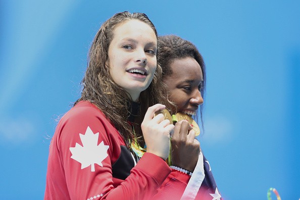 Simone Manuel of the United States who dead heated with Penny Oleksiak of Canada to both win the gold medal in the Women's 100m Freestyle Final during the swimming competition at the Olympic Aquatics Stadium Aug,11, 2016 in Rio de Janeiro, Brazil. 