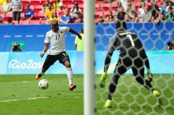 Germany winger Serge Gnabry (#17) shoots the ball against Portugal goalkeeper Varela Bruno.