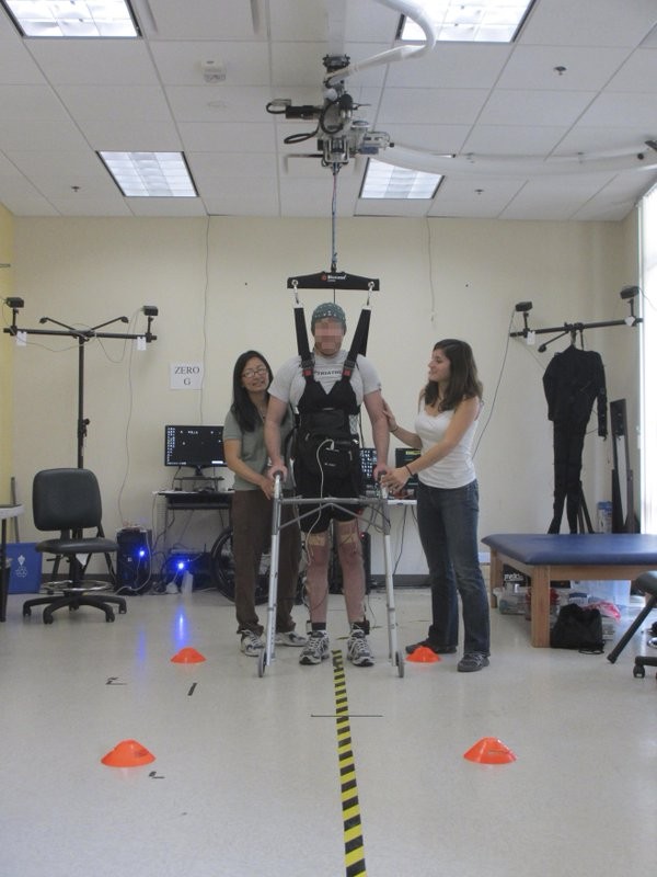 A paraplegic man is able to walk again after undergroing a brain-robot program that helps cure paralysis.