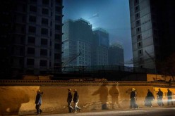 China is facing a real estate crisis because of slow urbanization.