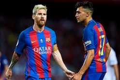 FC Barcelona forward Lionel Messi (L) and Munir El Haddadi.