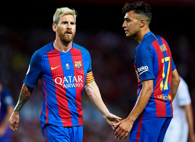 FC Barcelona forward Lionel Messi (L) and Munir El Haddadi.