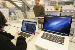 Apple MacBook Pro displayed at retail outlets for sale.