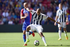 West Brom striker Salomón Rondón (R) competes for the ball against Crystal Palace's Andros Townsend.